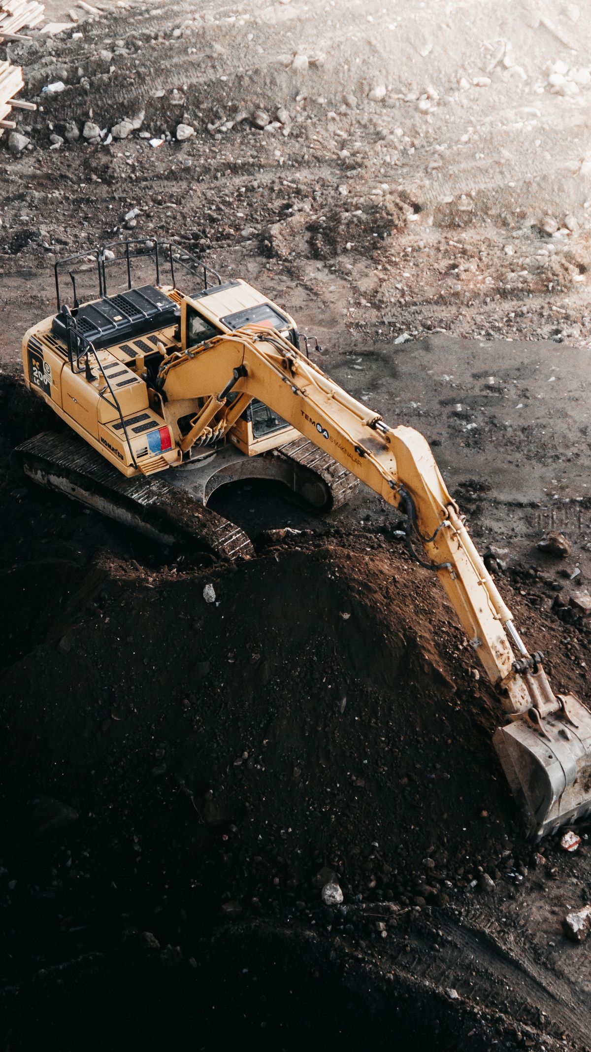 Excavator digging on a road rehabilitation site